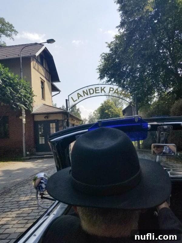 pulling into Landek Park in a historic car