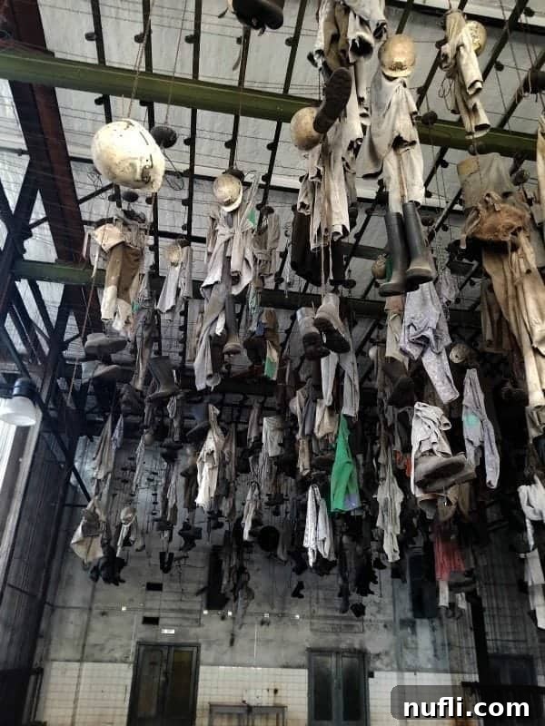Ostrava's Vintage Wheels Adventure 8 Miners' clothes hanging from chains on the ceiling in the changing area at Landek Park