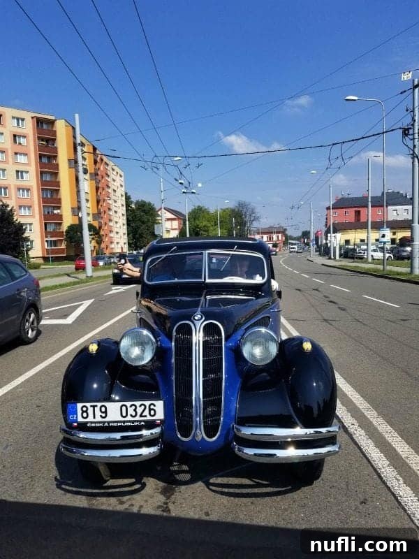 Ostrava's Vintage Wheels Adventure 10 Historic car cruising past architectural landmarks in Ostrava