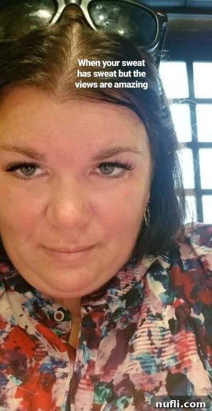 Tammilee sweating and wearing sunglasses, looking warm