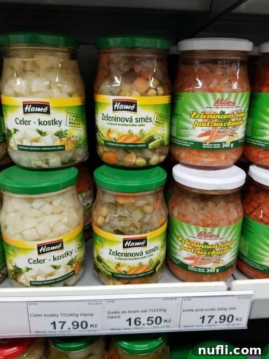 The Real Cost of Groceries in the Czech Republic 22 glass jars of vegetables on the grocery shelf