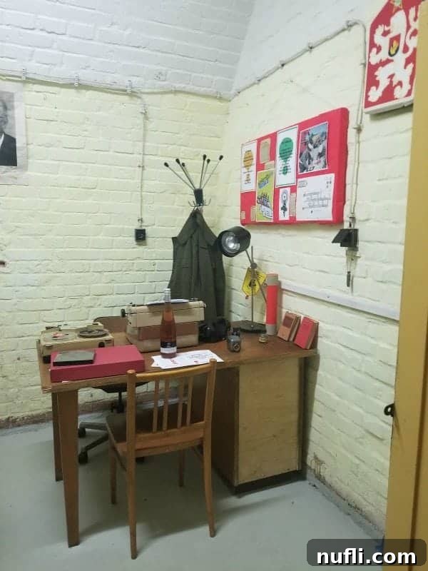 office desk with wine, typrewriter, lamp and supplies in the nuclear war bunker 