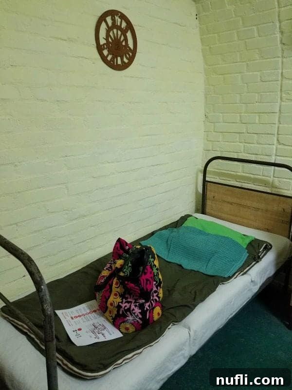 cot with blankets and a bag in the nuclear war bunker 