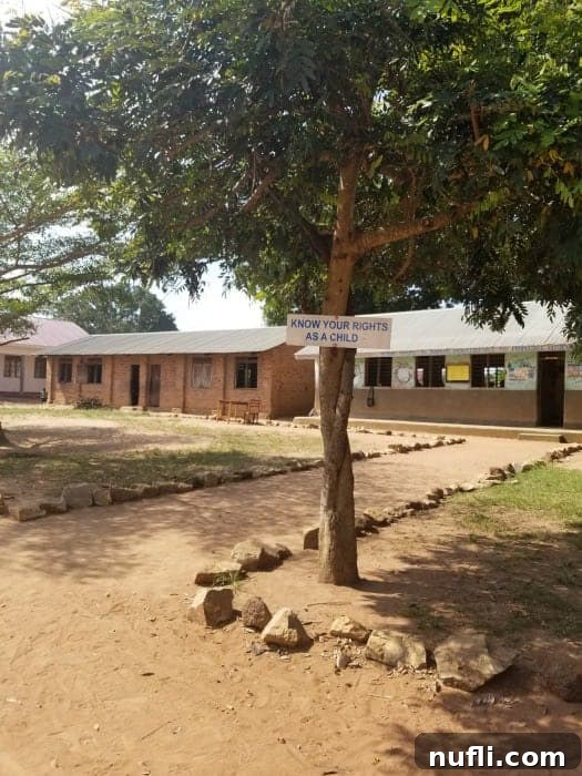 A vibrant sign at a Ugandan school reminding children of their rights, a testament to World Vision's child protection initiatives.