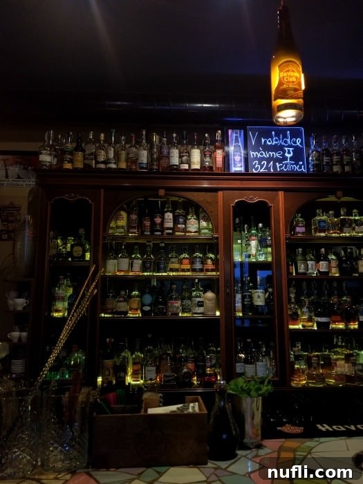 Interior of a cubana bar in Brno with bottles and signs 
