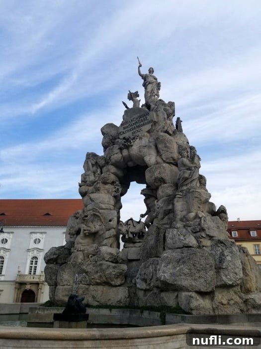 Baroque statue in the middle of a town square 