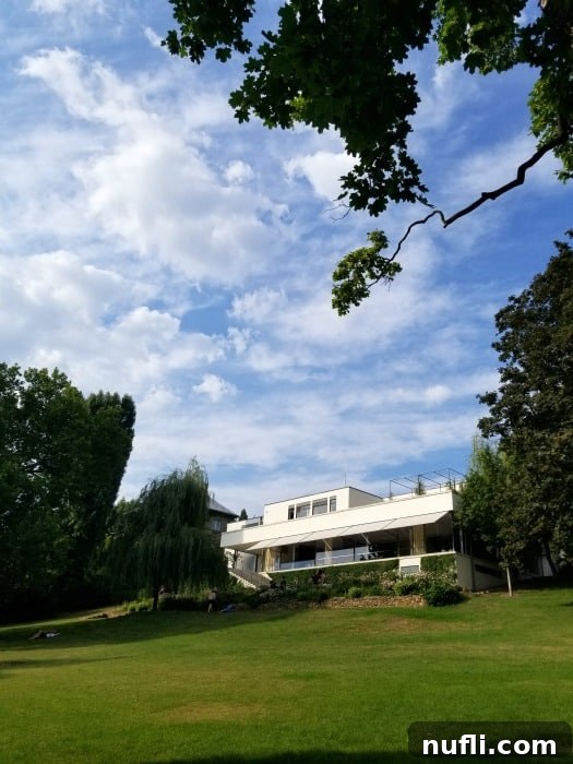 Villa Tugendhat Brnos Modernist Marvel 3 Villa Tugendhat on the hillside on a blue sky day with clouds