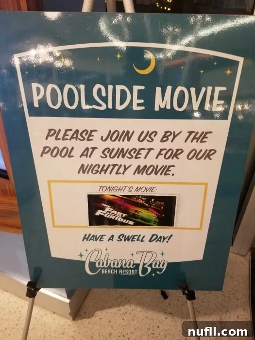 Poolside movie sign for Cabana Bay Beach Resort, inviting guests to an evening film screening