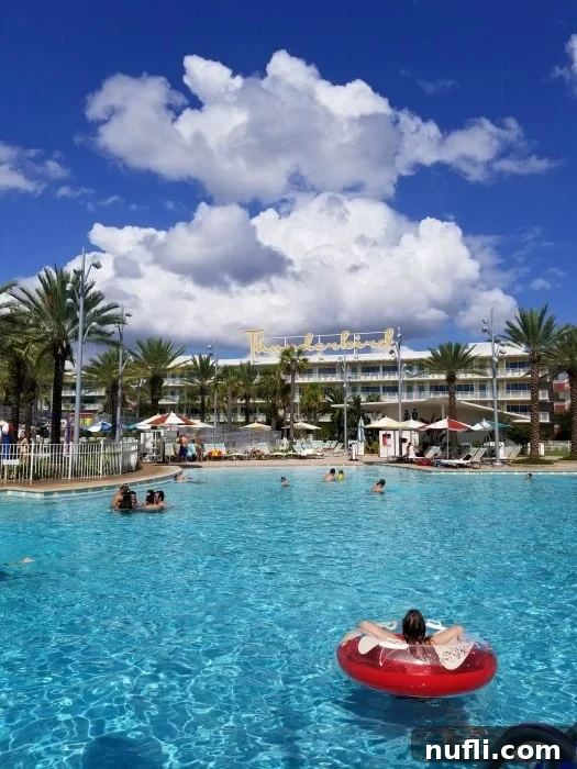 Cabana Bay Beach Resort pool with guests enjoying the water, showcasing the vibrant atmosphere