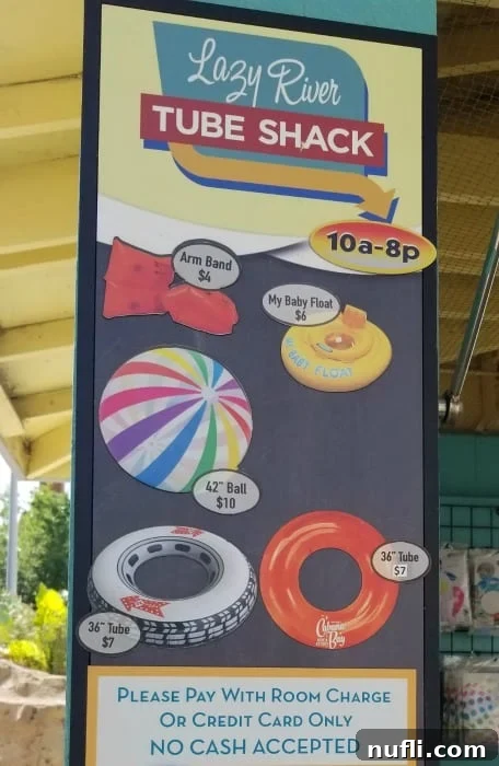 Lazy River Tube Shack sign with various pool floats displayed for sale