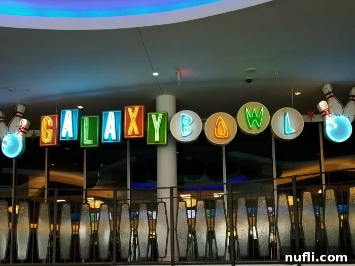 Neon sign for Galaxy Bowl featuring glowing bowling pins and retro fonts
