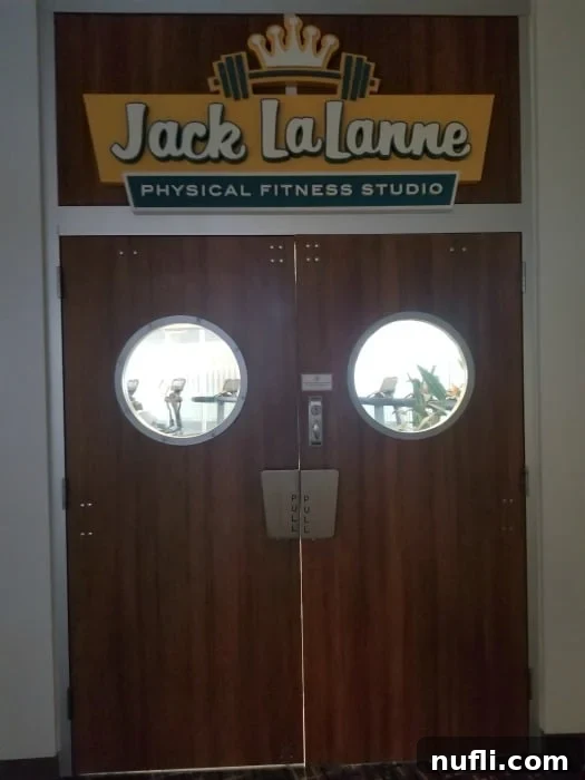 Jack LaLanne Physical Fitness Studio sign above classic wood doors, reflecting a vintage gym aesthetic