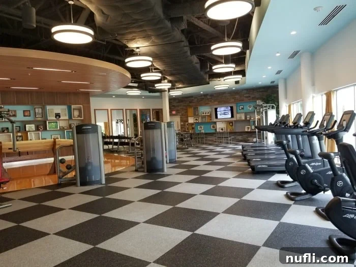 Workout room interior with vintage pictures on the wall and various gym equipment, themed to Jack LaLanne