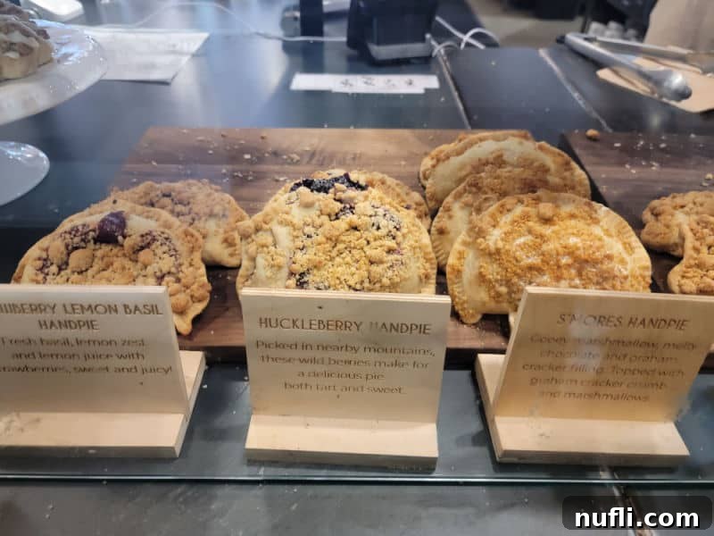 small handpies on display with blueberry lemon, huckleberry, and smores