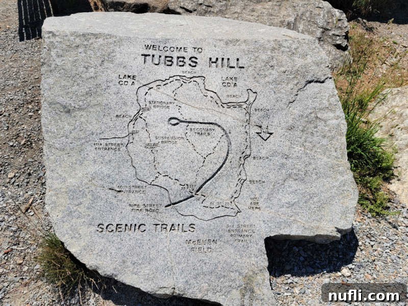 Tubbs Hill scenic trail map etched in a large rock