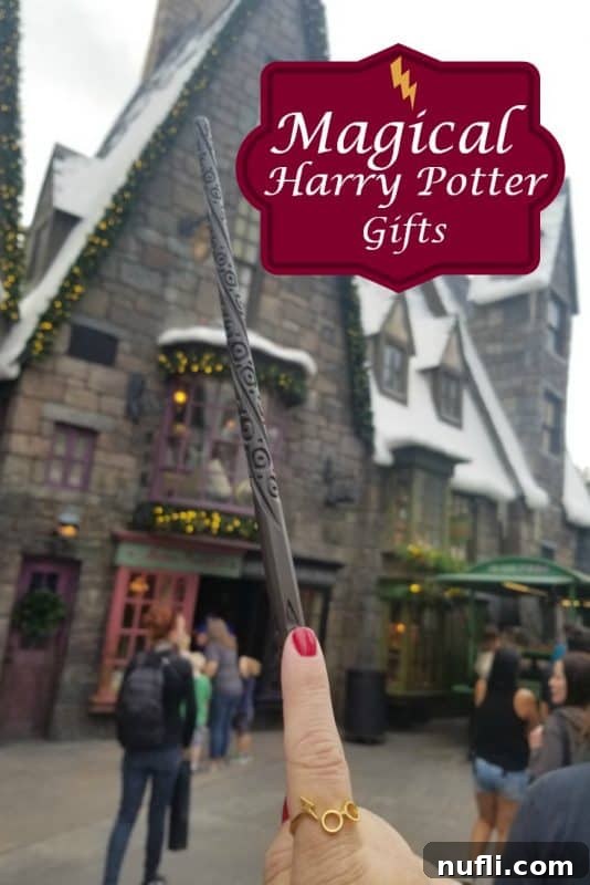 A hand holding a magical wand, ready to cast a spell, with a blurred background of enchanting lights, representing the essence of Harry Potter gifts.