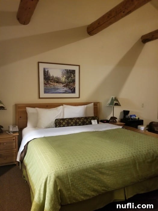 The Pines Resort - Bass Lake, California: A Video Tour 3 Bed with a green cover on it, bear lamps, in the Pines Resort suite