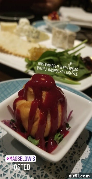 Gourmet Brie wrapped in fry bread with a raspberry drizzle at Masselow's Steakhouse