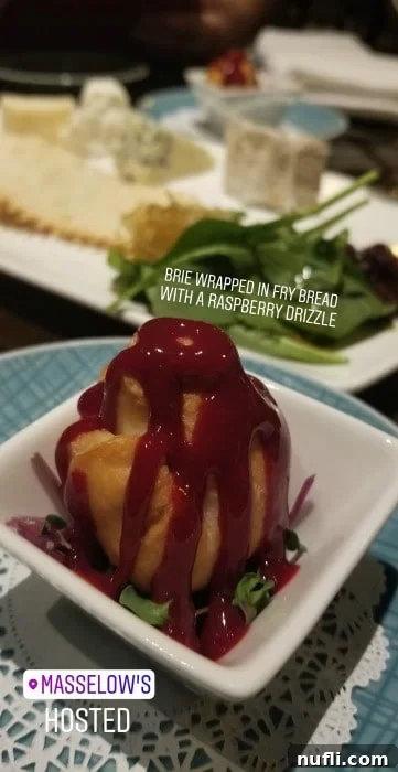 Gourmet Brie wrapped in fry bread with a delicate raspberry drizzle