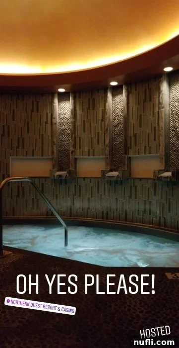 Serene spa area with a luxurious hot tub and warm lighting