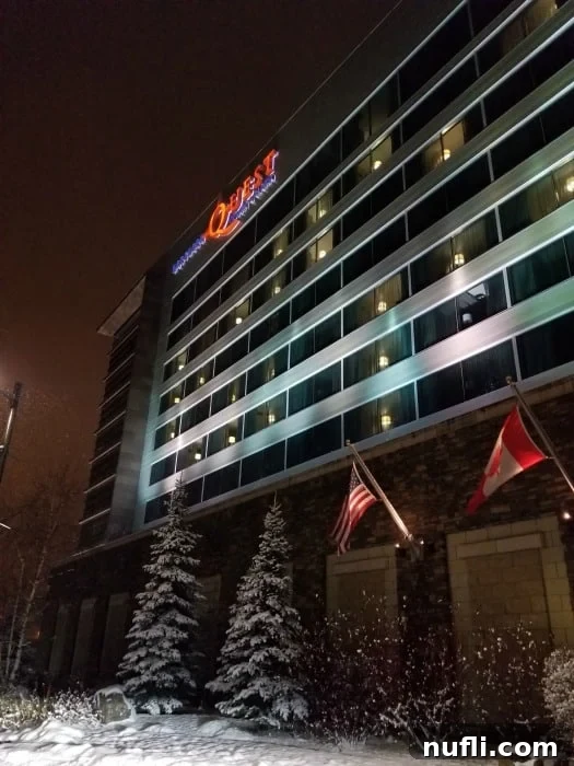 Northern Quest Resort & Casino facade covered in snow with snow-laden trees