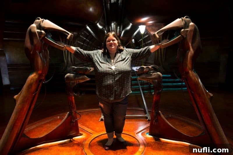 Tammilee stands on the Captain Marvel set, looking immersed in the behind-the-scenes environment.