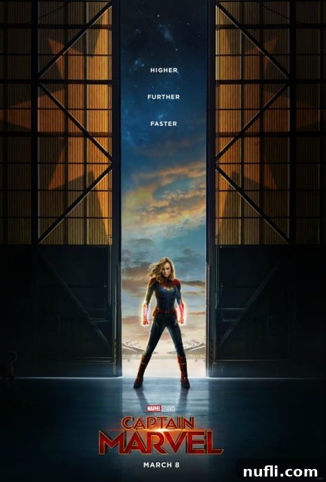 Another dynamic Captain Marvel movie poster, highlighting her iconic suit and cosmic powers.