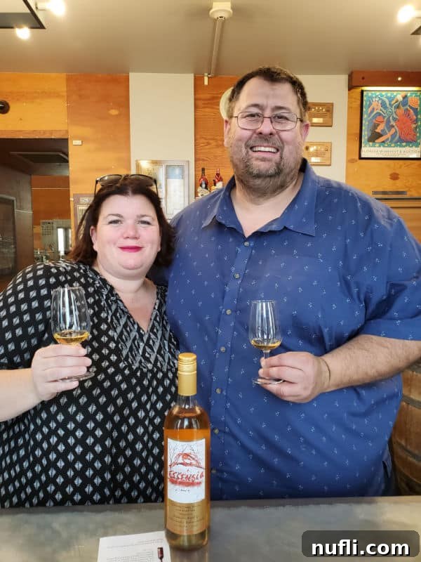 Tammilee Tips and Park Ranger John enjoying a wine tasting experience at Quady Winery.