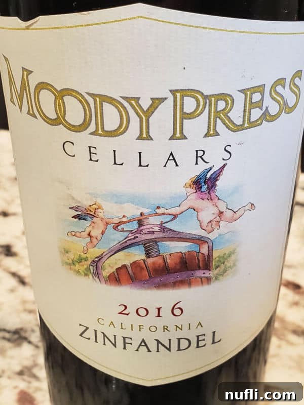 Moody Press Cellars wine label, adorned with two elegant angels, for a 2016 California Zinfandel.