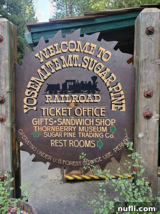 Welcome to Yosemite Mt Sugar Pine Railroad ticket office sign at the entrance