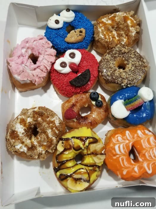 Fun donuts including elmo in a white box