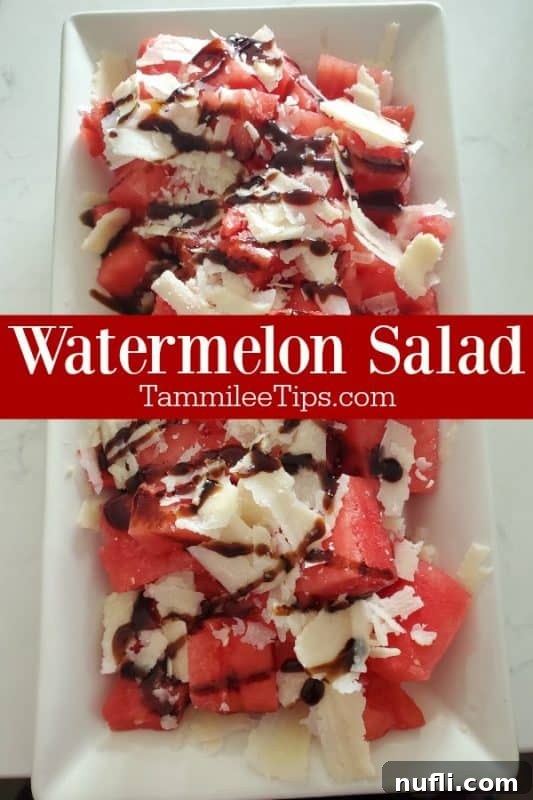 Fresh Watermelon Salad served on a white platter, garnished with Pecorino Romano cheese and balsamic glaze.
