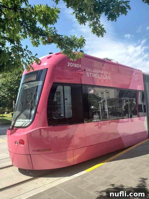 Pink Oklahoma City Street car by trees