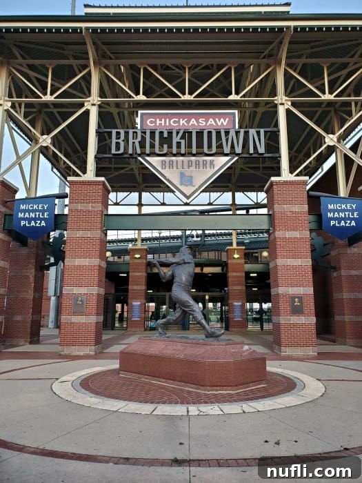 Chickasaw Bricktown Ballpark entrance with baseball player statue