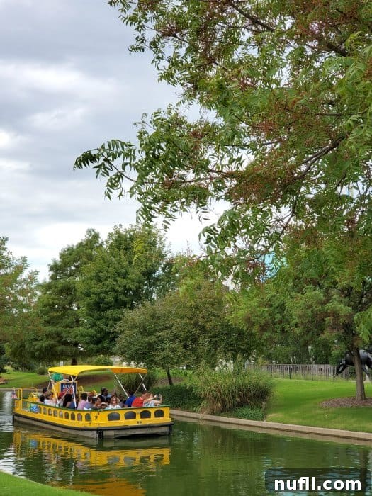 Yellow water taxi next to trees