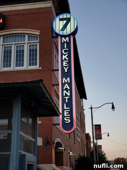 7 Mickey Mantles sign on the side of a brick building 
