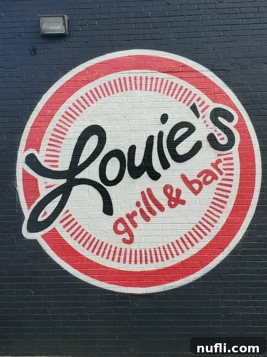 Louies grill and bar sign 