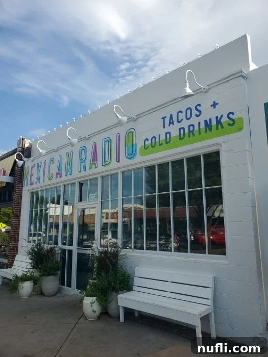 Mexican Radio tacos + cold drinks over a glass door and window 