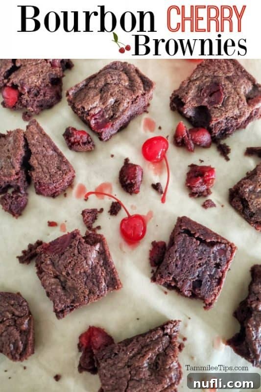 Fudgy Bourbon Cherry Brownies 2 Delicious homemade Bourbon Cherry Brownies cut into squares, garnished with fresh cherries, on parchment paper.