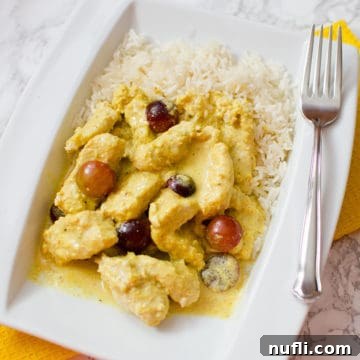 Slow Cooker Turkey Curry Delights 6 Turkey Curry on a white plate with rice