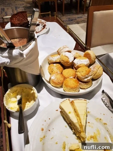 scones, cheesecake, and chocolate cake on a tray