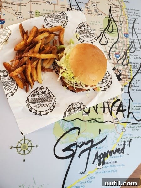 Guy's burger joint burger and fries on a florida map table