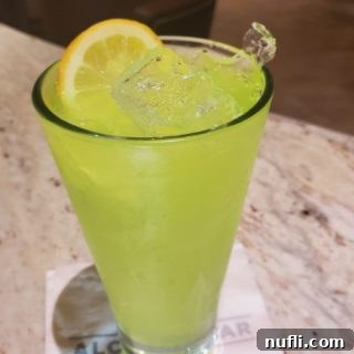 quick fix cocktail text over a lime green cocktail in a tall glass