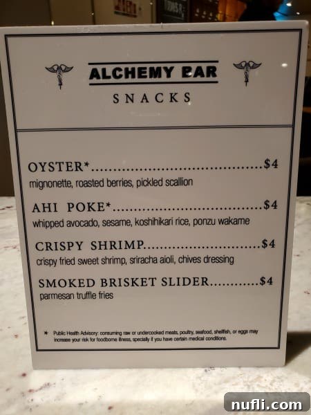 Alchemy Bar snacks menu featuring various small plates