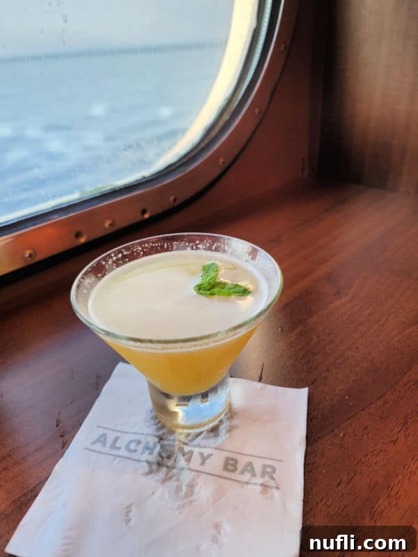 Everything You Need to Know About the Carnival Cheers Package 4 Carnival Alchemy bar napkin under a Spicy Chipotle Martini on a wooden shelf by the window