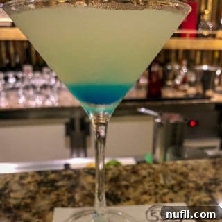 Seven Seas Martini over a layered cocktail in a martini glass
