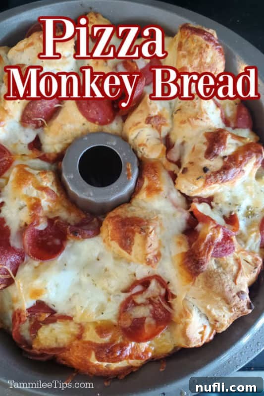 Golden brown pepperoni pizza monkey bread in a silver Bundt Pan with text overlay