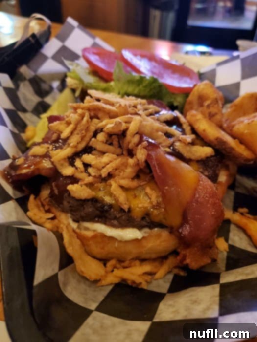 burger with fried onions and fries