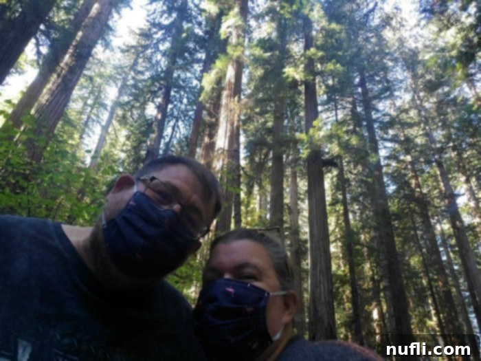 John and Tammilee standing under Redwood Trees
