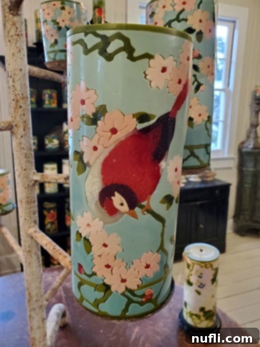 candle with a bird and flowers engraved in it